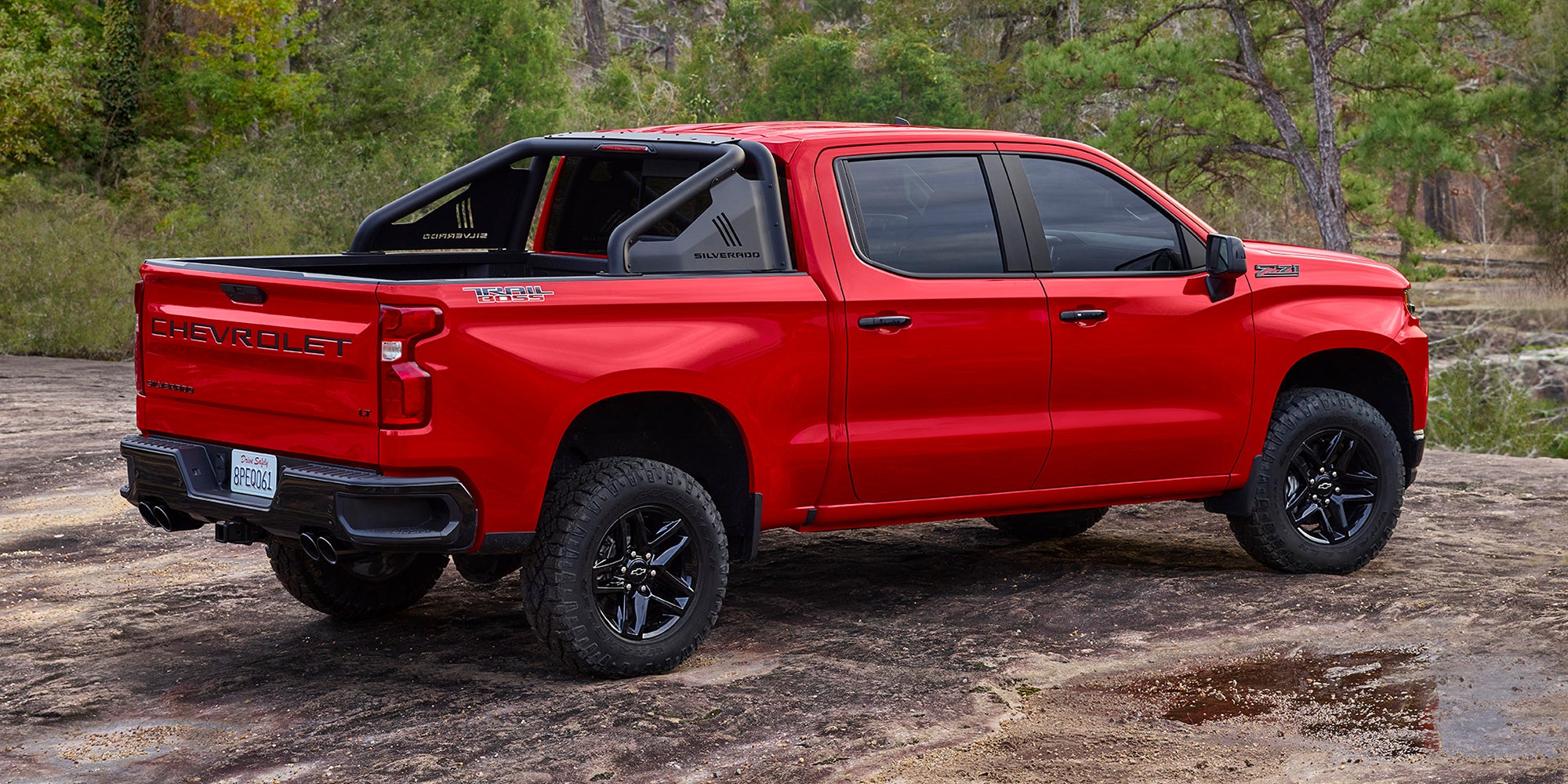 Image of red 2022 Chevrolet Silverado parked on the mountain valley