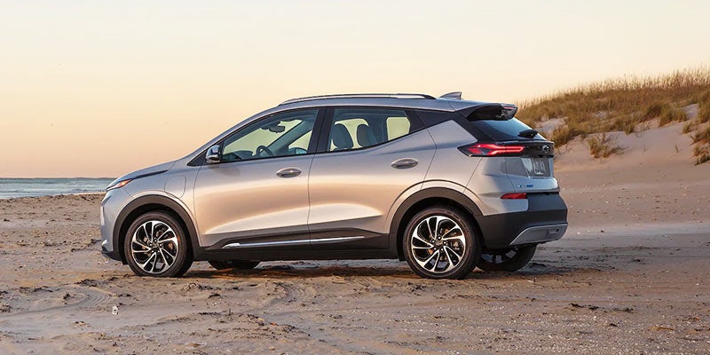 Image of a silver 2022 Chevrolet Bolt EUV parked on the beach