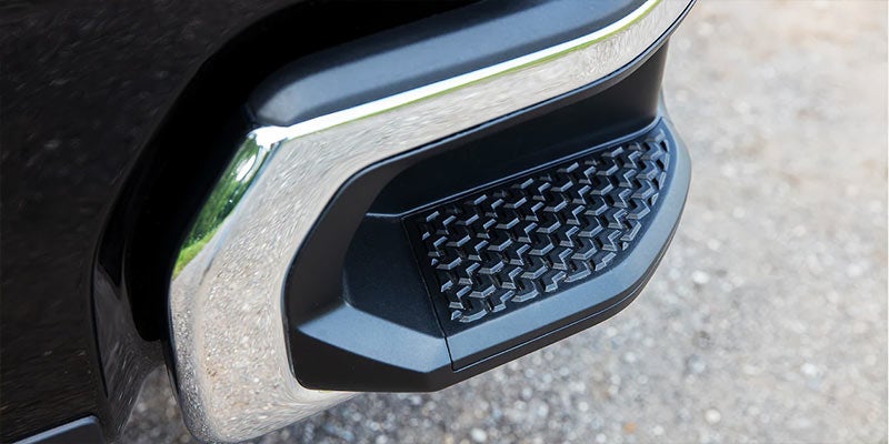 Image close-up of a 2022 Chevrolet Silverado truck's rear bumper corner step with a textured non-slip surface, designed for easier bed access