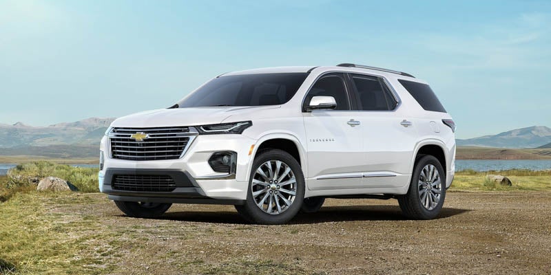 Image of a white color 2023 Chevrolet Traverse parked on the lakeside