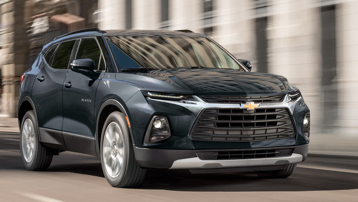 Image of darkblue 2022 Chevrolet Blazer driving on the road