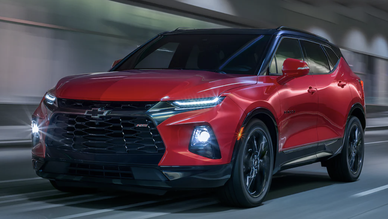Image of red 2022 Chevrolet Blazer driving on the road in the tunnel