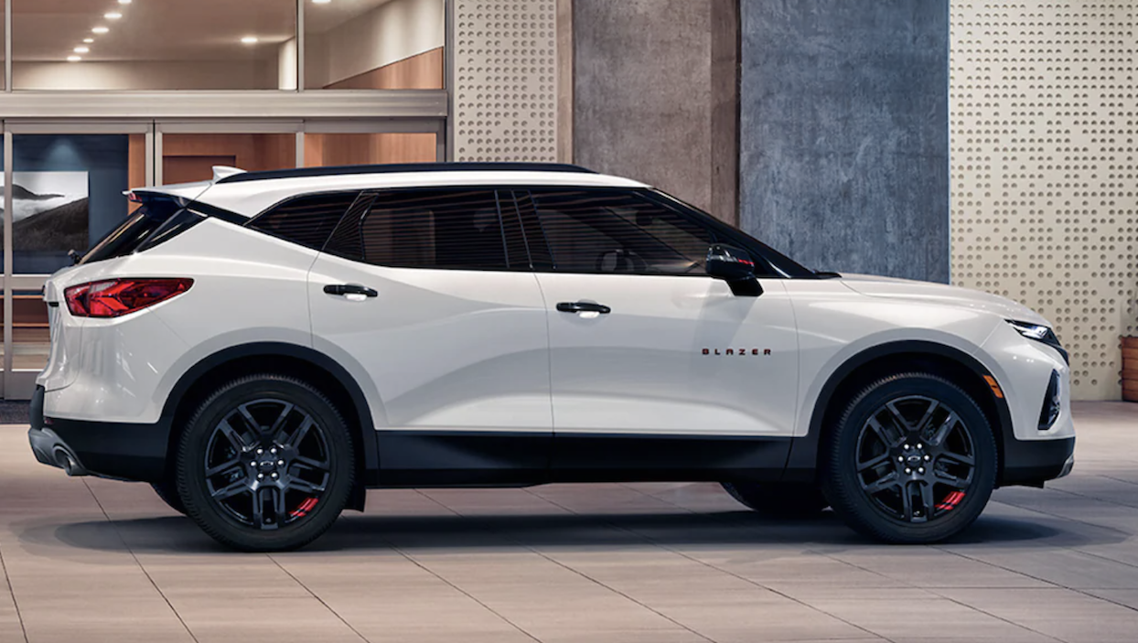 Image of white 2022 Chevrolet Blazer parked in front of the showroom