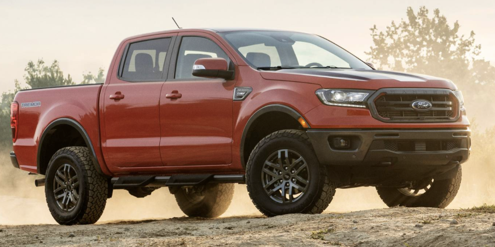 Image of red 2022 Ford Ranger parked in a dusty off-road