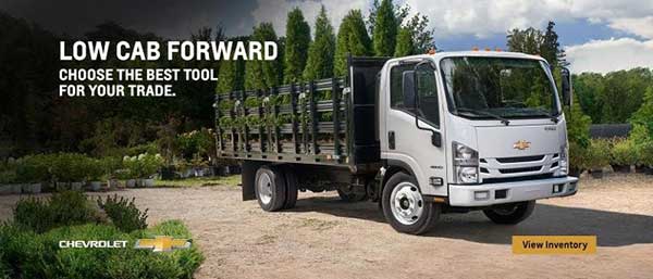 A white Low Cab truck